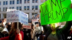 FILE - Demonstrators, critical of what many see as Republican presidential candidate Donald Trump's extreme views on some issues, protest in Washington, D.C., March 21, 2016.