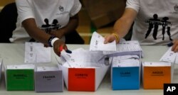 Votes for Britain's Labour Party leader Jeremy Corbyn are placed in a pile as they are counted at his constituency in London, June 9, 2017. Britain voted Thursday in an election that started out as an attempt by Prime Minister Theresa May to increase her clout ahead of Brexit negotiations.