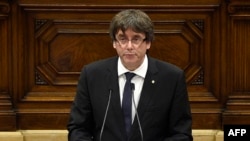 Catalan regional government president Carles Puigdemont gives a speech at the Catalan regional parliament in Barcelona, Oct. 10, 2017.