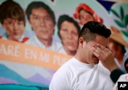 FILE - Christian, from Honduras, recounts his separation from his child at the border during a news conference at the Annunciation House, in El Paso, Texas, June 25, 2018.