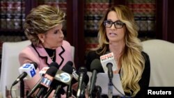 Jessica Drake speaks to reporters about allegations of sexual misconduct against Donald Trump, alongside lawyer Gloria Allred (L) during a news conference in Los Angeles, California, Oct. 22, 2016.