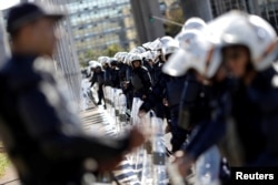 Military policemen reinforce security in front of National Congress before a protest against President Michel Temer's proposed economic reforms in a national general strike organized by unions, in Brasilia, Brazil, June 30, 2017.
