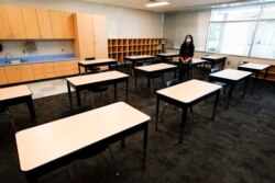 FILE - Principal Susan Stevens talks to the media during a demonstration of a socially-distanced classroom at A.J. Whittenberg Elementary School of Engineering Monday, July 20, 2020, in Greenville, S.C. (AP Photo/Chris Carlson)
