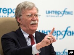U.S. National security adviser John Bolton gestures while speaking to the media after his talks with Russian President Vladimir Putin in Moscow, Russia, June 27, 2018.