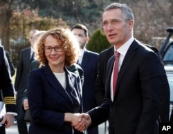 NATO Secretary-General Jens Stoltenberg is welcomed by Macedonian Defense Minister Radmila Sekerinska Jankovska upon his arrival at the Defense Ministry in Skopje, Macedonia, Jan. 19, 2018.