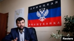 Denis Pushilin, senior member of the pro-Russia separatist rebellion leadership, meets with journalists in Donetsk, May 12, 2014.