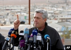 FILE - U.N. refugee chief Filippo Grandi speaks to the press during a visit to the Zaatari Syrian Refugee Camp, in Mafraq, Jordan, Feb. 12, 2018.