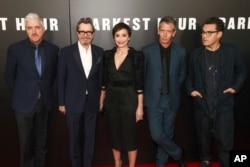 Anthony McCarten, from left, Gary Oldman, Kristin Scott Thomas, Ben Mendelsohn and Joe Wright attend the premiere of "Darkest Hour" at The Paris Theatre on Wednesday, Nov. 15, 2017, in New York. (Photo by Andy Kropa/Invision/AP)