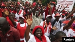 Supporters of the ruling All People's Congress party's President Ernest Bai Koroma attend a rally outside State House in the center of Sierra Leone's capital Freetown, October 11, 2012.
