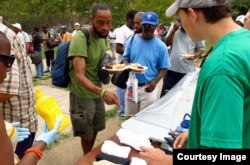 Eagle scout hands out socks in Philadelphia.