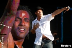 Ruzzo and Yotuel (L) of the Cuban hip-hop Orishas band perform at the Rock in Rio music festival in Lisbon, June 6, 2008.