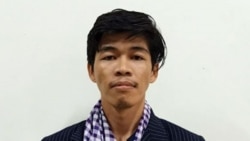 FILE: Sovann Rithy, TVFB founder and reporter, seen wearing a blue and white scarf, was questioned by the police on Wednesday and charged by the Phnom Penh court on Thursday. (Photo by Phnom Penh Municipal Police Facebook Page)