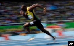 Jamaica's Usain Bolt competes in a men's 200-meter heat during the athletics competitions of the 2016 Summer Olympics at the Olympic stadium in Rio de Janeiro, Brazil, Aug. 16, 2016.