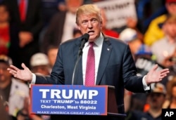 FILE - Republican presidential candidate Donald Trump gestures during a rally in Charleston, West Virginia, May 5, 2016.