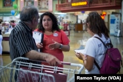 Alicia Contreras, Interim Nevada State Director for Mi Familia Vota, helps to register voters in a predominantly Latino neighborhood of East Las Vegas.