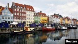 In this file photo, boats are anchored in the Nyhavn district of Copenhagen, Denmark, Dec. 5, 2009. Global watchdog Transparency International said Wednesday its latest annual Corruption Perceptions Index report Denmark and New Zealand performed best in 2016.