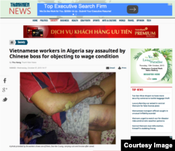 Thanh Nien website with handout photo from Vietnamese workers