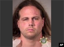 This booking photo provided by Multnomah County Sheriff's Office in Portland, Ore., shows Jeremy Joseph Christian.