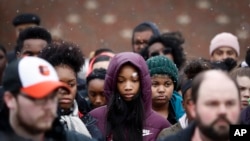 Students gather on their soccer field during a 17-minute walkout protest at the Stivers School for the Arts in Dayton, Ohio, March 14, 2018.