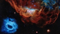 A handout photo made available by the European Space Agency shows one of the most photogenic examples of the many turbulent stellar nurseries the NASA/ESA Hubble Space Telescope has observed during its 30-year lifetime.