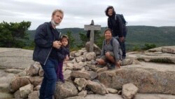 Thai real estate agent Ploysong Chaichoochote Chapman (second from right) with her family. They live in Syracuse, New York