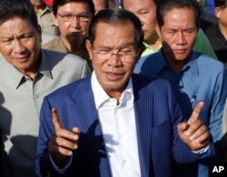 FILE - Cambodian Prime Minister Hun Sen gestures while speaking in Phnom Penh, Cambodia, Aug. 1, 2018.