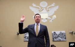 FILE - FBI Director James Comey is sworn in on Capitol Hill in Washington, July 7, 2016.