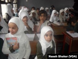 Eight-year-old Bayan, right, lost her older sister when 2,000 girls tried to evacuate their school at the same time, in Sanaa, Yemen, pictured April 20, 2019.