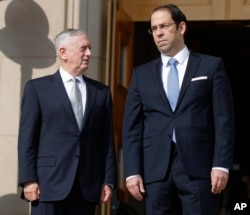 Defense Secretary Jim Mattis, left, hosted an enhanced honor cordon for Tunisian Prime Minister Youssef Chahed at the Pentagon, July 10, 2017.