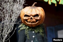 A person dressed as a pumpkin monster poses at the premiere of the film "Goosebumps," in Los Angeles, California October 4, 2015.