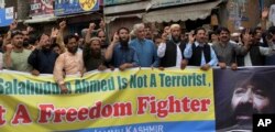 Supporters of the Pasban-e-Hurriyat Jammu Kahsmir political party chant anti-Indian slogans during a rally to condemn sanctions imposed on Syed Salahuddin by the U.S State Department, in Muzaffarabad, the capital of Pakistan-controlled Kashmir, June 27, 2017.