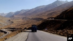 In this Wednesday, Sept. 23, 2009. Troubled highway is seen near Pol-I-Kumari, Afghanistan, along the one time Silk Road route.