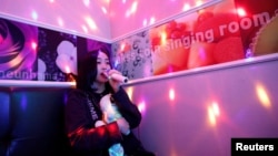Japanese Yuuka Hasumi, 17, who wants to become a K-pop star, sings a song as she spends time after class, in the Hongdae area of Seoul, South Korea, April 3, 2019.