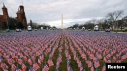 Thousands of U.S. flags are seen at the National Mall, as part of a memorial paying tribute to the U.S. citizens who have died from the COVID-19, near the Capitol ahead of President-elect Joe Biden's inauguration, in Washington, D.C.