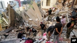 Lebanese soldiers search for survivors after a massive explosion in Beirut, Lebanon, Aug. 5, 2020.