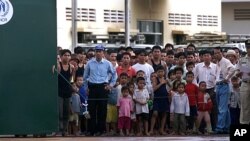 Heron-hooded dancers perform as they parade down the streets toward Asakusa Shrine in the compound of Sensoji Temple in Tokyo, Japan prior to the annual Sanja Festival, one of the three major festivals scheduled on May 16-18.