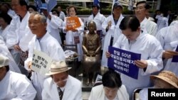 FILE - Descendants of Koreans who were conscripted to the Japanese imperial army or recruited for forced labor under Japan's colonization attend an anti-Japan rally in Seoul, South Korea, June 22, 2015. New lawsuits concerning WWII forced labor have been filed.