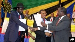 FILE - South Sudan's President Salva Kiir (L) is seen shaking hands with rebel leader Riek Machar (R) following a previous round of peace talks.