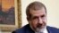 FILE - The leader of the Crimean Tatars' assembly, known as the Mejlis, Refat Chubarov, attends a press conference in the Crimean capital, Simferopol, on May 16 2014.