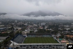 Storm clouds descend over the Francisco Morazan stadium during rains brought on by Tropical Storm Sara in San Pedro Sula, Honduras, Nov. 15, 2024.