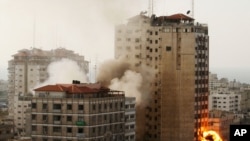 A Chinese family member of a passenger onboard missing Malaysia Airlines Flight MH370 screams as she is being brought into a room outside the media conference area at a hotel near Kuala Lumpur International Airport, March 19, 2014. 