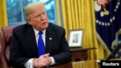 U.S. President Donald Trump sits for an exclusive interview with Reuters journalists in the Oval Office at the White House in Washington, Dec. 11, 2018. 