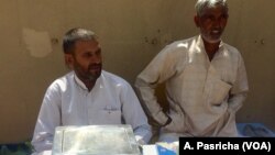 Farmer Bhim Singh (left) says farmers suffer a loss because they cannot set the price of crops but have to depend on middlemen.