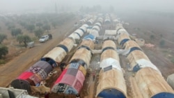 FILE - A picture taken with a drone shows tents of internally displaced Syrians in Northern Aleppo countryside, Syria, Dec. 19, 2020.
