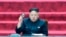 In this Wednesday, April 9, 2014 image made from video, North Korean leader Kim Jong Un holds up parliament membership certificate during the Supreme People's Assembly in Pyongyang, North Korea