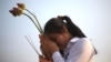 Two girls offer prayers to Cambodia's former King Norodom Sihanouk in Phnom Penh, February 4, 2013.