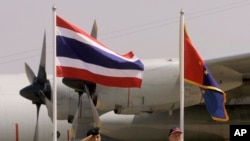 FILE - Thailand's Deputy Supreme Commander Gen. Montri Sangkhasap, left, and First Secretary to the U.S. Embassy in Thailand James F. Entwistle, right, review the honor guard at the 27th Cobra Gold military exercise in northeastern Thailand, May 8, 2008.