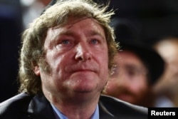 FILE - Argentine President Javier Milei attends a Hanukkah celebration in Buenos Aires, Dec. 12, 2023. Milei has said that the goal of his sweeping economic decree was to "start along the path to rebuilding the country."