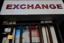 An exchange shop is seen close amid a crackdown on some exchange shops by authorities around the country that the blame for inciting the crisis, at Beirut's commercial Hamra Street, Lebanon, March 16, 2021.