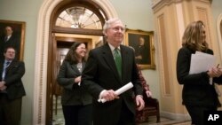 Senate Majority Leader Mitch McConnell, R-Ky., leaves the chamber after announcing an agreement in the Senate on a two-year, almost $400 billion budget deal, at the Capitol in Washington, Feb. 7, 2018. 